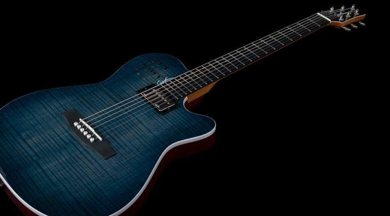 Blue flame top silent hybrid acoustic-electric guitar against black background.