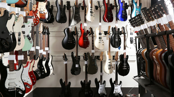 a guitar shop display wall