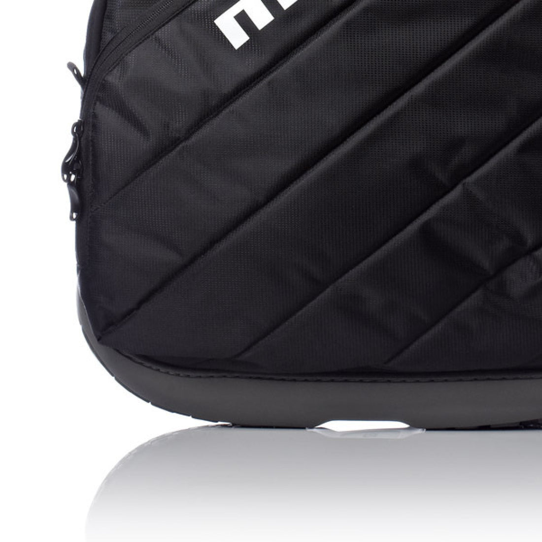 Close-up of a black padded sports bag with diagonal stitched panels and a white logo on a white background.